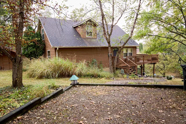 a house with trees in front of it
