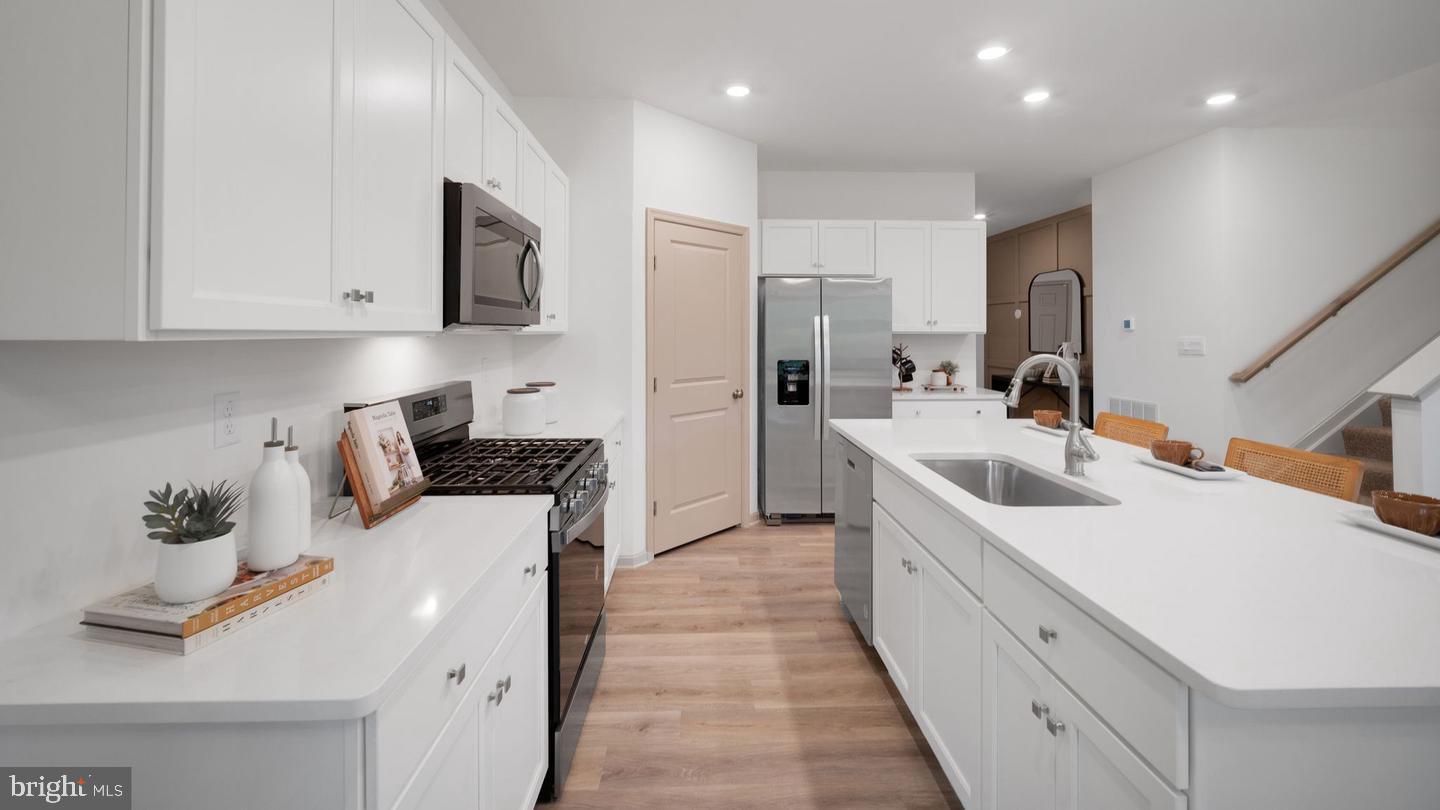 205 Bella Drive York, PA 17404 - Photo 5 of 27 a kitchen with stainless steel appliances a sink stove and cabinets