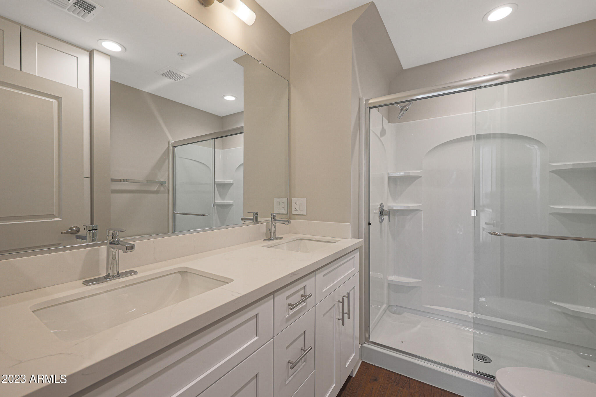 6060 East Baseline Road, Unit 156 Mesa, AZ 85206 - Photo 18 of 45 a bathroom with a shower sink and mirror