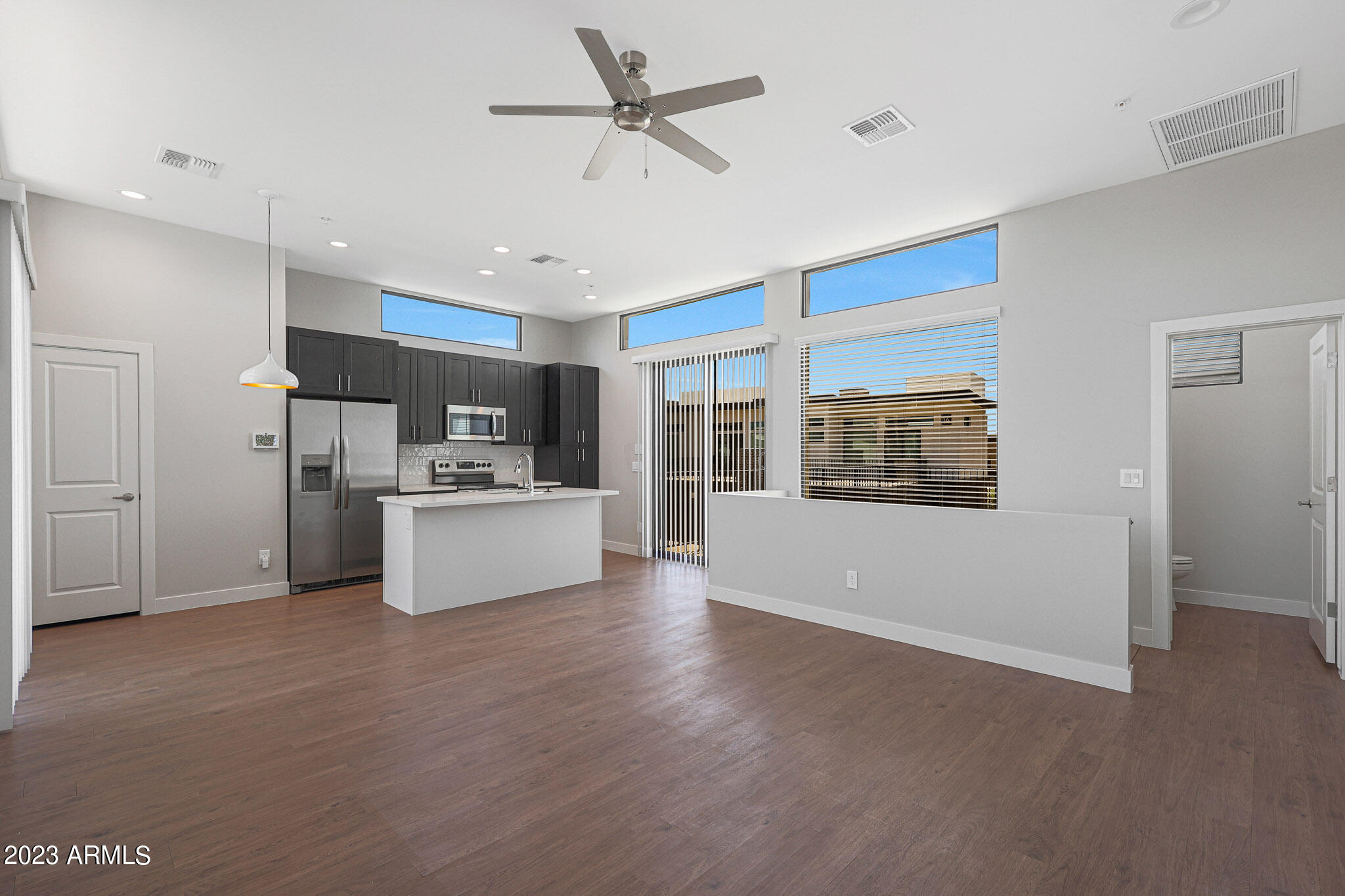 6060 East Baseline Road, Unit 156 Mesa, AZ 85206 - Photo 21 of 45 a view of kitchen with stainless steel appliances refrigerator oven and cabinets