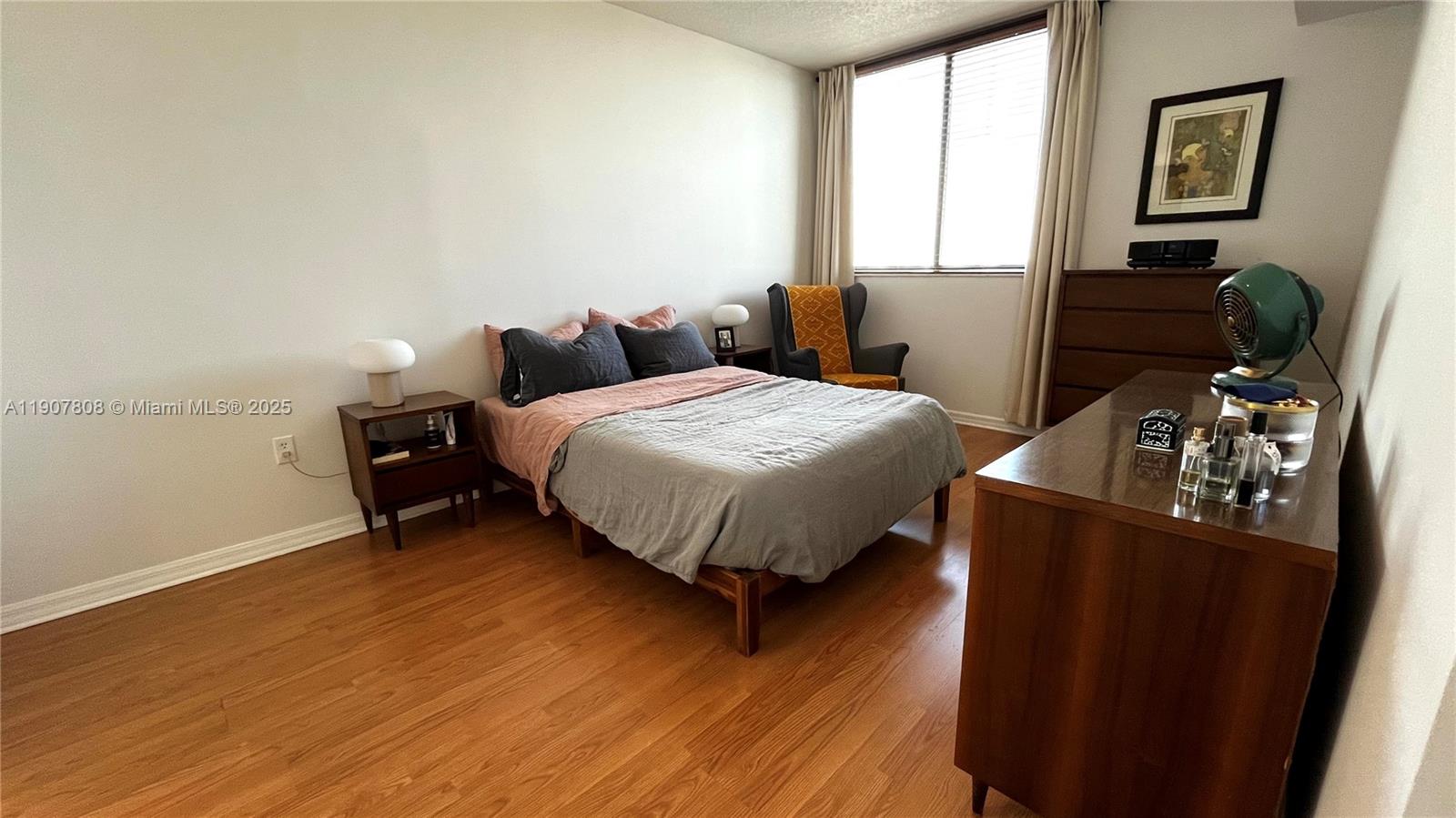 4242 Northwest 2nd Street, Unit 703 Miami, FL 33126 - Photo 11 of 25 a bed room with bed and a window