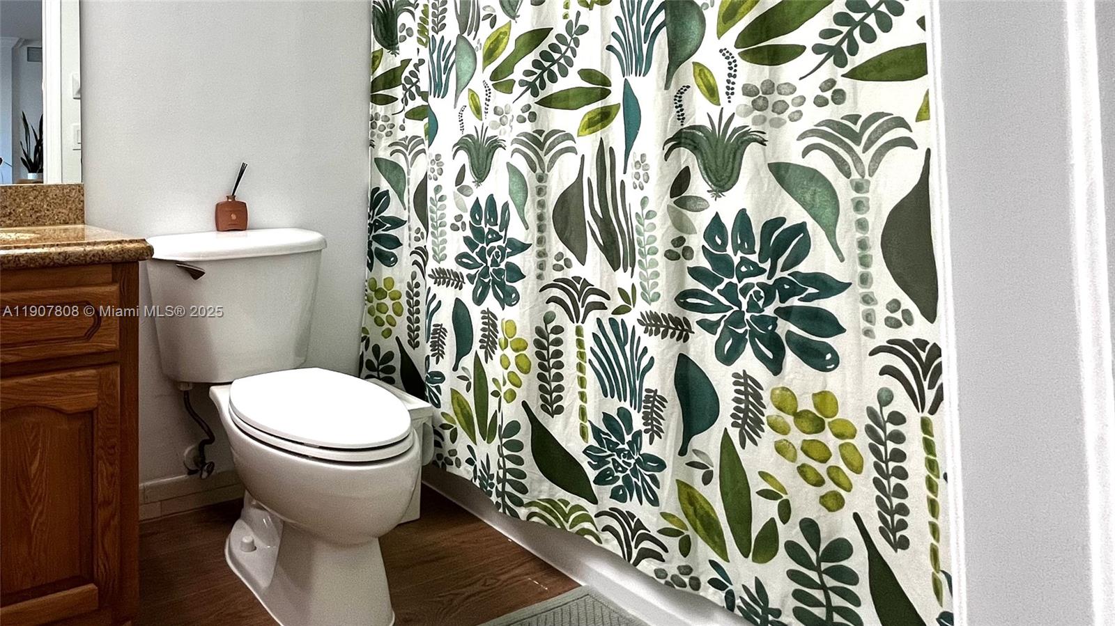 4242 Northwest 2nd Street, Unit 703 Miami, FL 33126 - Photo 17 of 25 a bathroom with a toilet and a sink