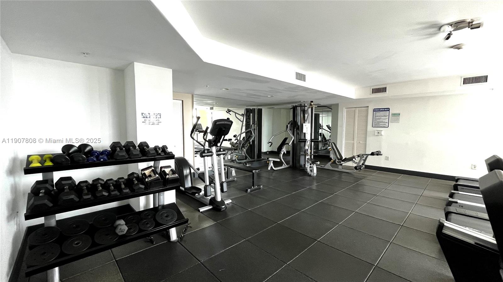 4242 Northwest 2nd Street, Unit 703 Miami, FL 33126 - Photo 22 of 25 a view of a room with gym equipment