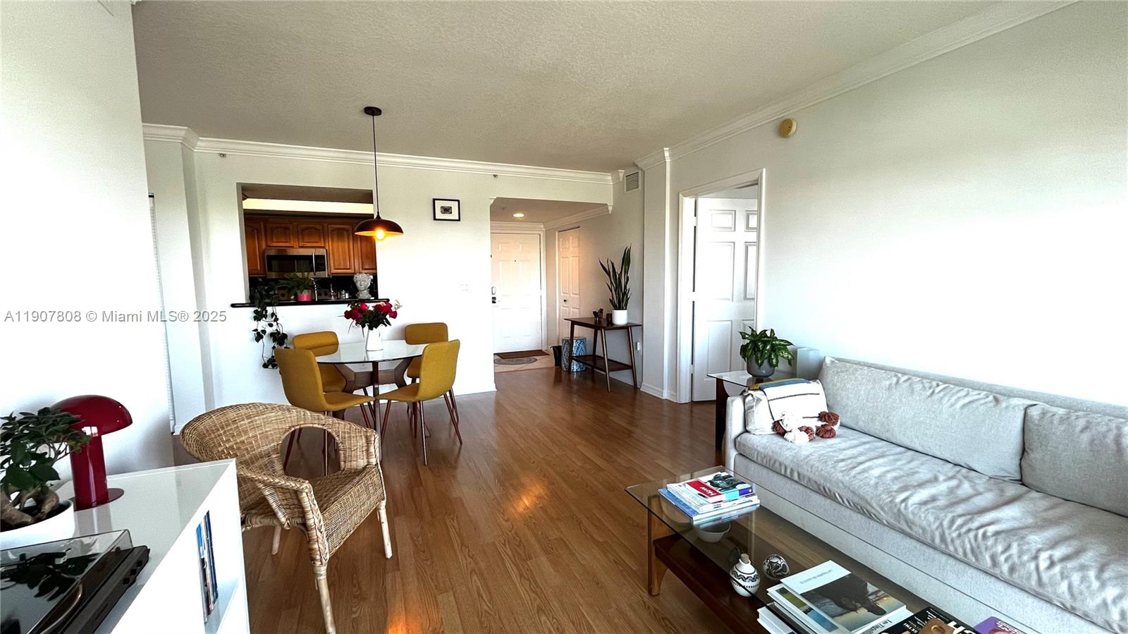 4242 Northwest 2nd Street, Unit 703 Miami, FL 33126 - Photo 3 of 25 a living room with furniture