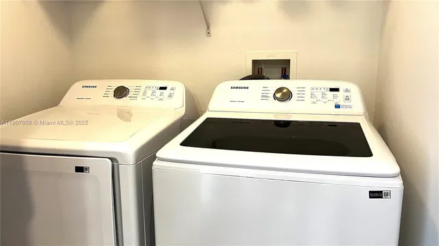 a utility room with washer and dryer