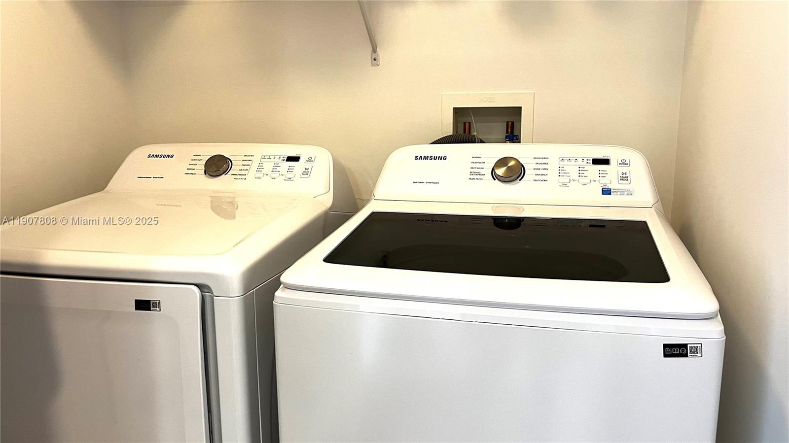 4242 Northwest 2nd Street, Unit 703 Miami, FL 33126 - Photo 10 of 25 a utility room with washer and dryer