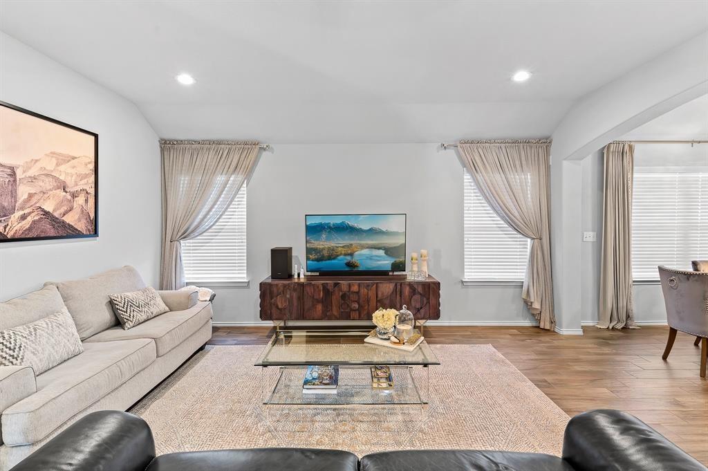 235 Limerick Road Buda, TX 78610 - Photo 5 of 11 Living room with wood finished floors, arched walkways, and recessed lighting