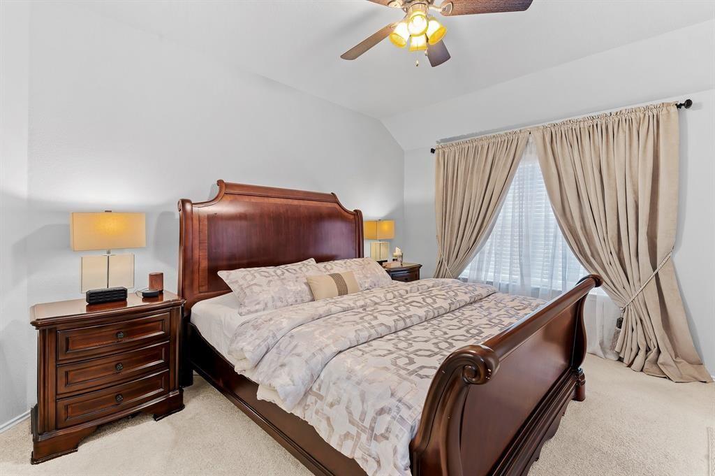 235 Limerick Road Buda, TX 78610 - Photo 8 of 11 Bedroom featuring light carpet, ceiling fan, and lofted ceiling