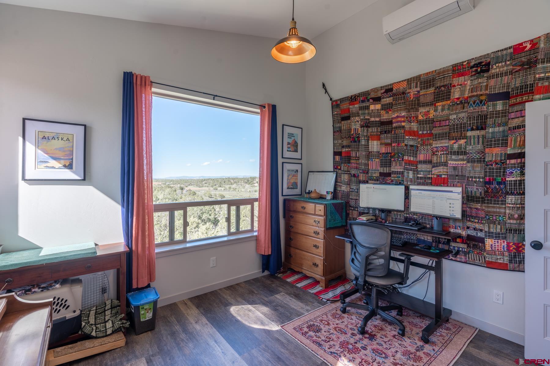 68 Cody Road Durango, CO 81303 - Photo 12 of 35 a view of a workspace with furniture and a window