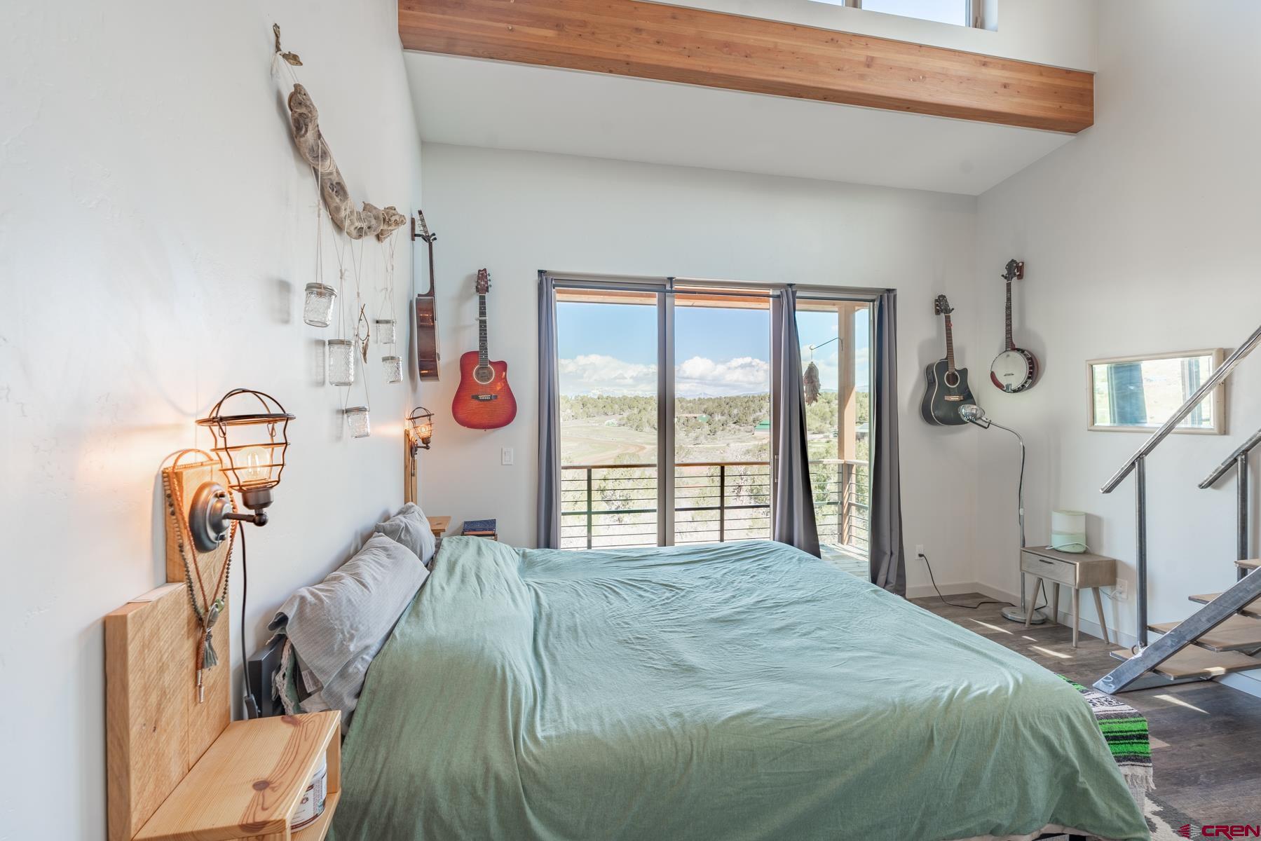 68 Cody Road Durango, CO 81303 - Photo 13 of 35 a bed sitting in a bedroom next to a window