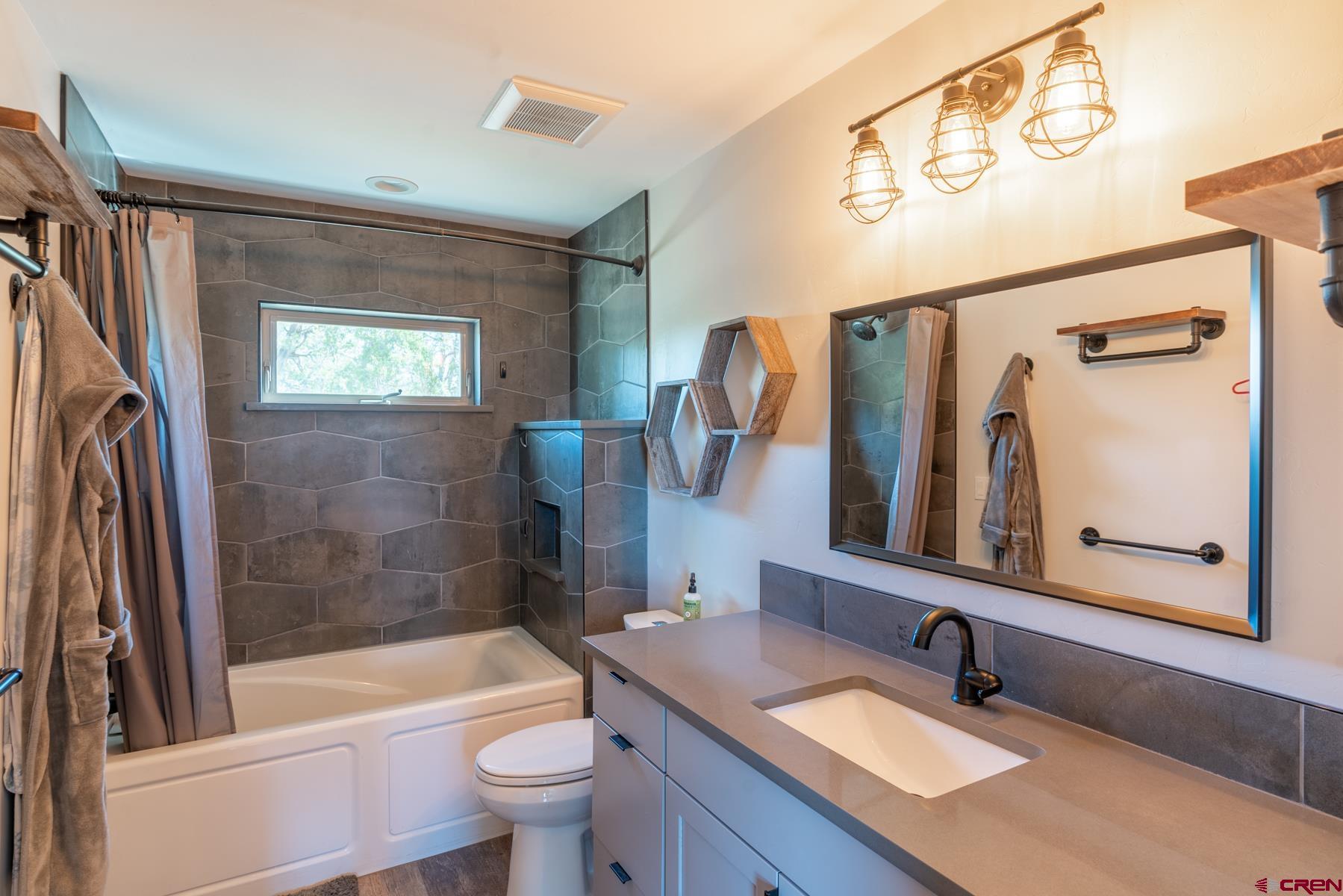 68 Cody Road Durango, CO 81303 - Photo 16 of 35 a bathroom with a sink a toilet and bathtub