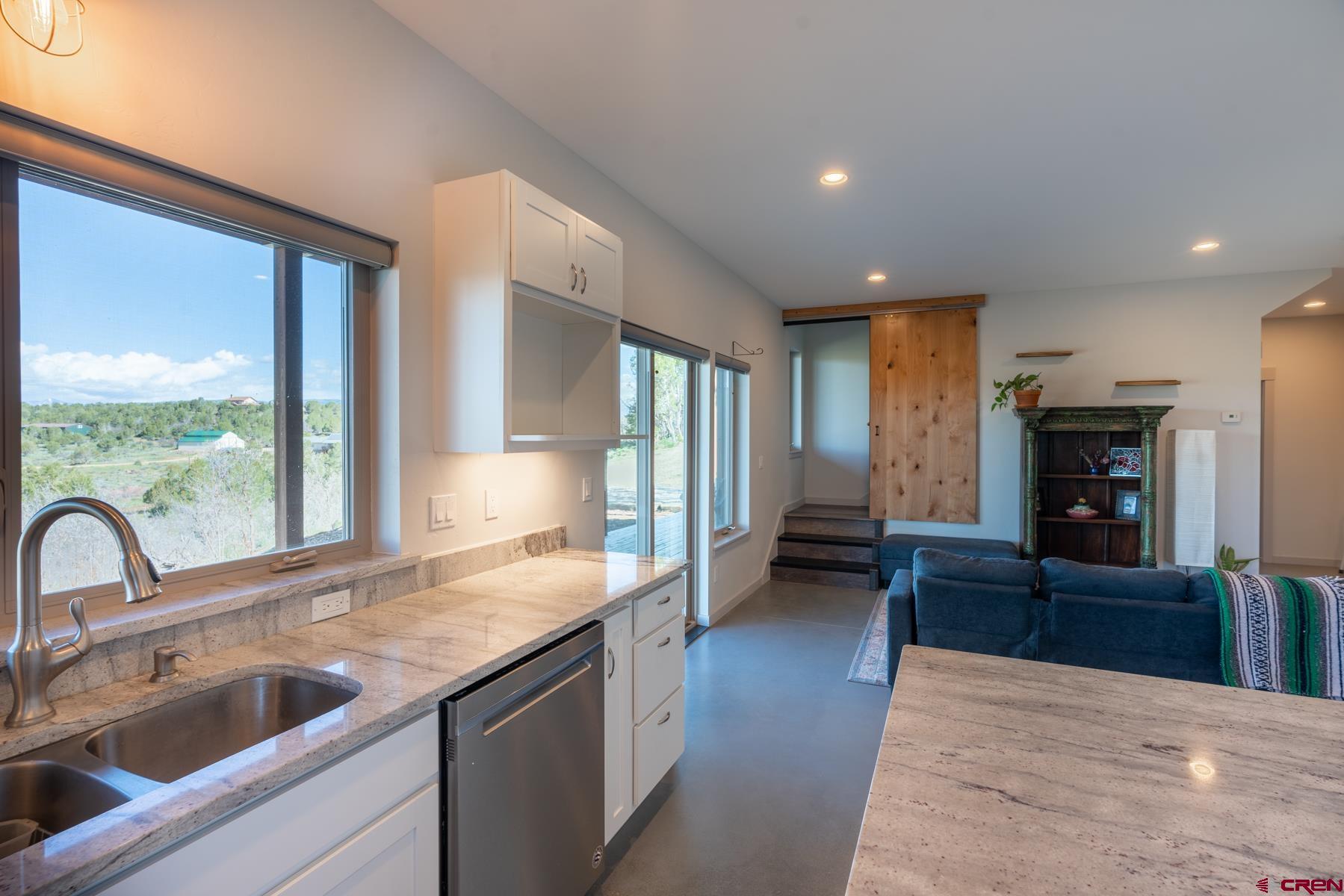 68 Cody Road Durango, CO 81303 - Photo 20 of 35 a kitchen with sink and refrigerator