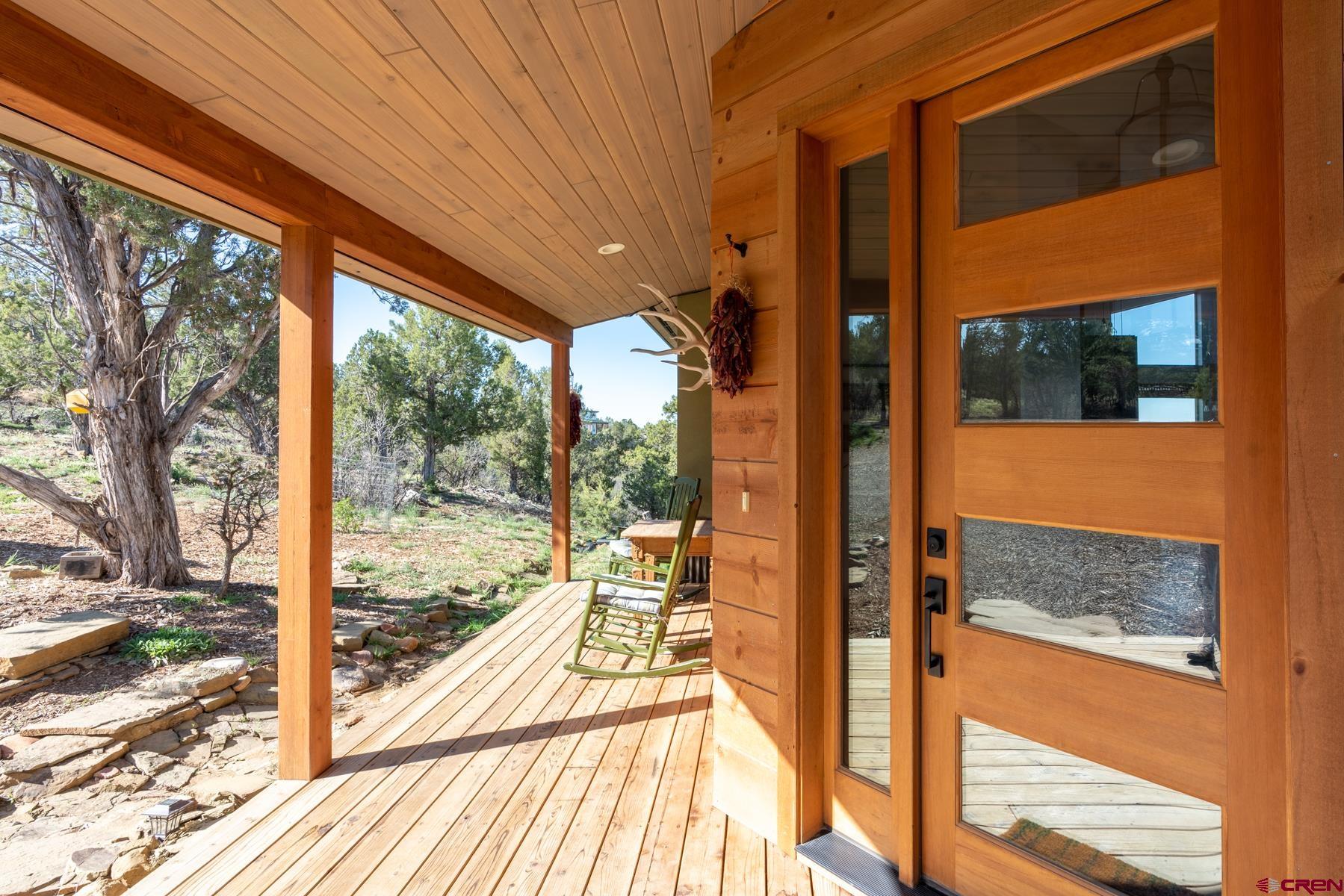 68 Cody Road Durango, CO 81303 - Photo 2 of 35 a view of a room with wooden floor and deck
