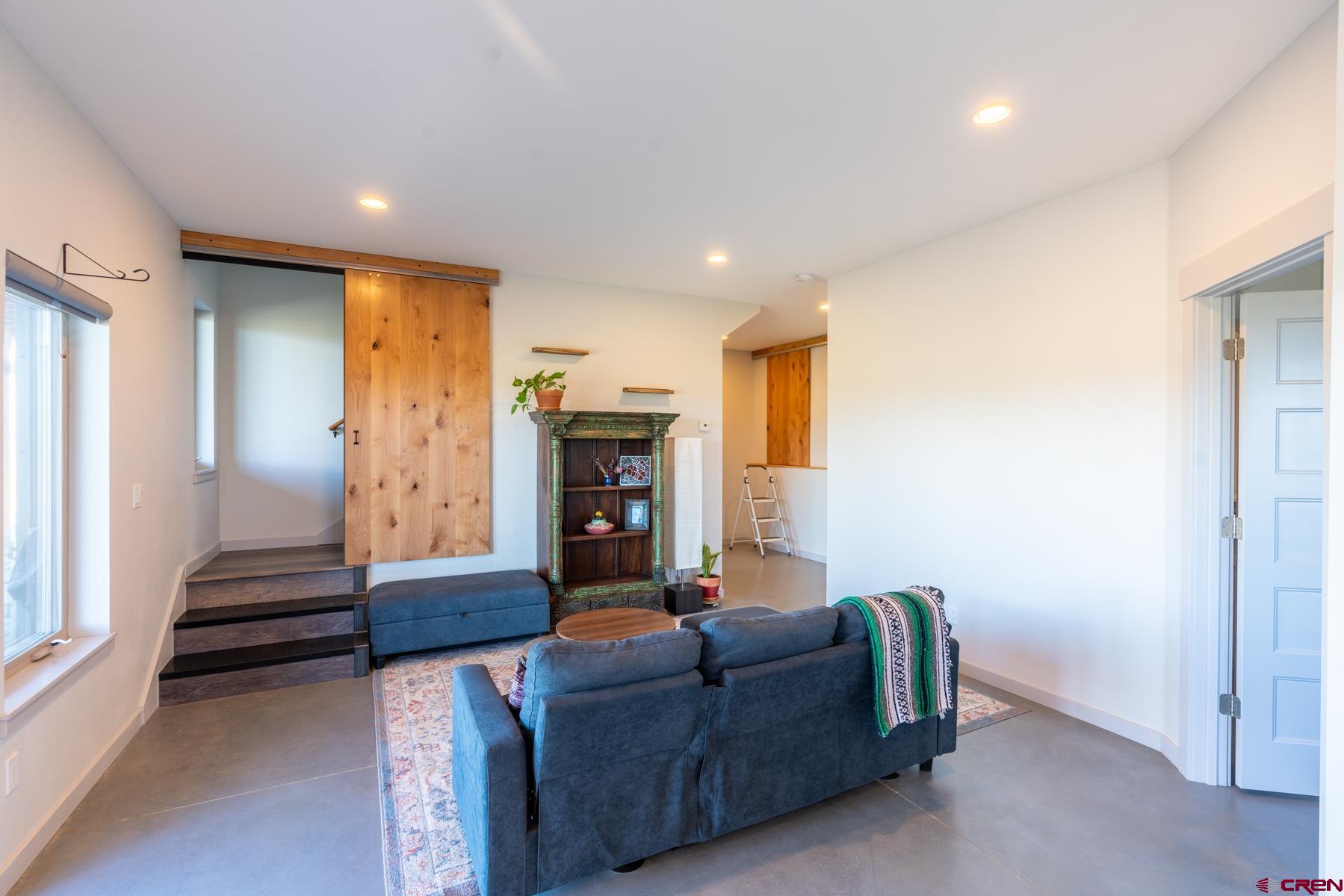 68 Cody Road Durango, CO 81303 - Photo 22 of 35 a living room with furniture and a window