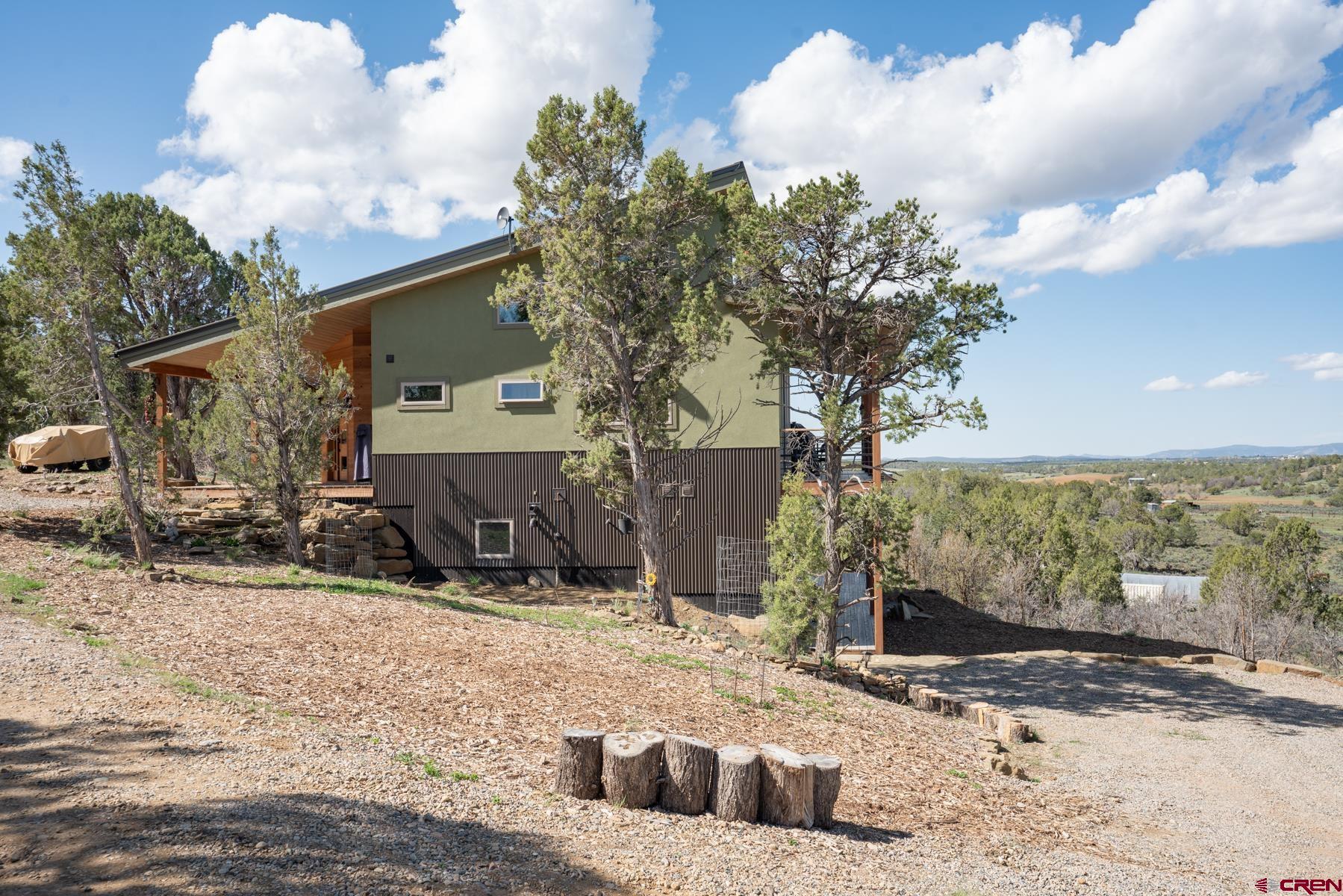 68 Cody Road Durango, CO 81303 - Photo 26 of 35 a view of a house with a snow in the yard
