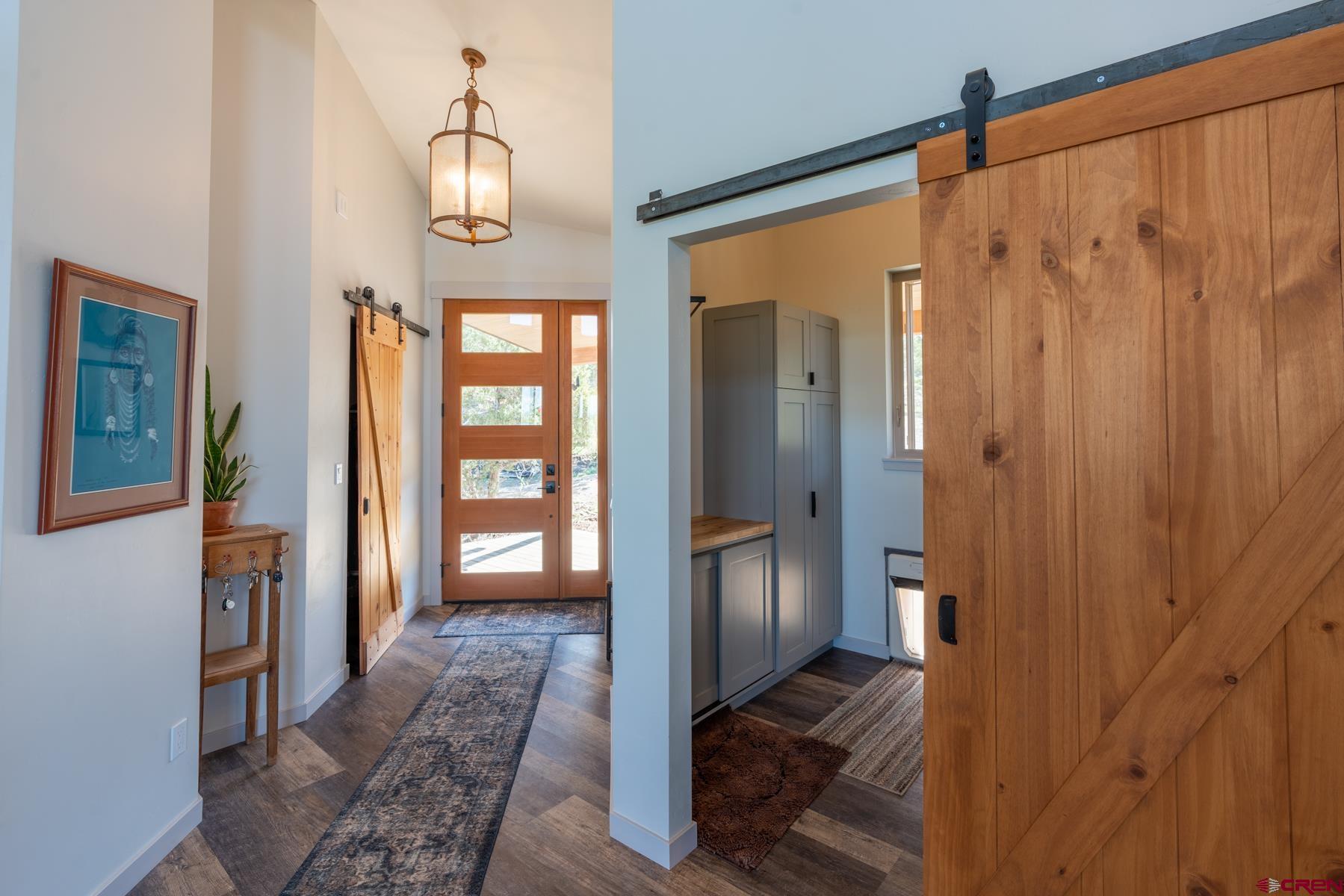 68 Cody Road Durango, CO 81303 - Photo 3 of 35 a view of a hallway with wooden floor and front door