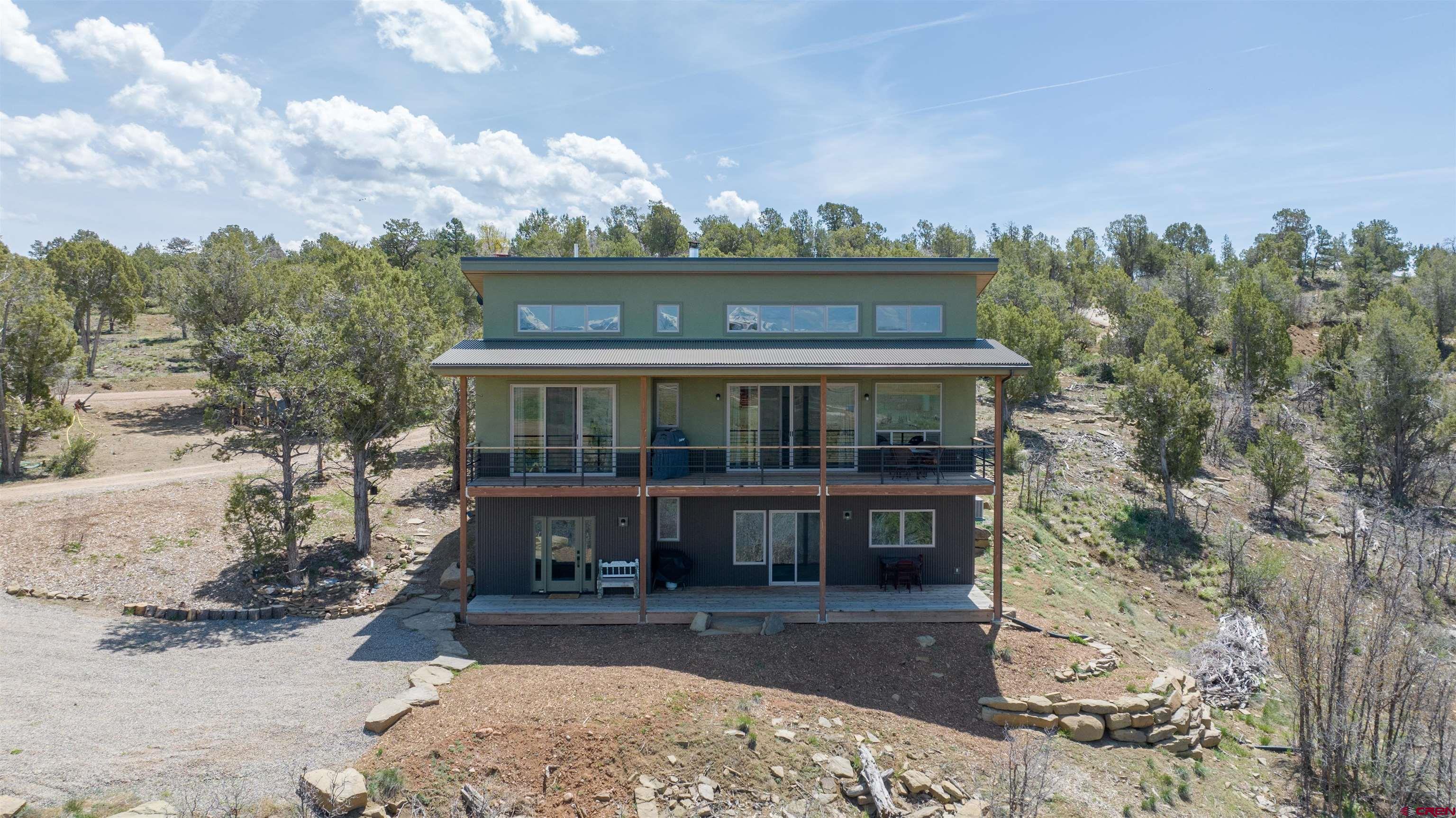 68 Cody Road Durango, CO 81303 - Photo 34 of 35 a view of a house with a yard