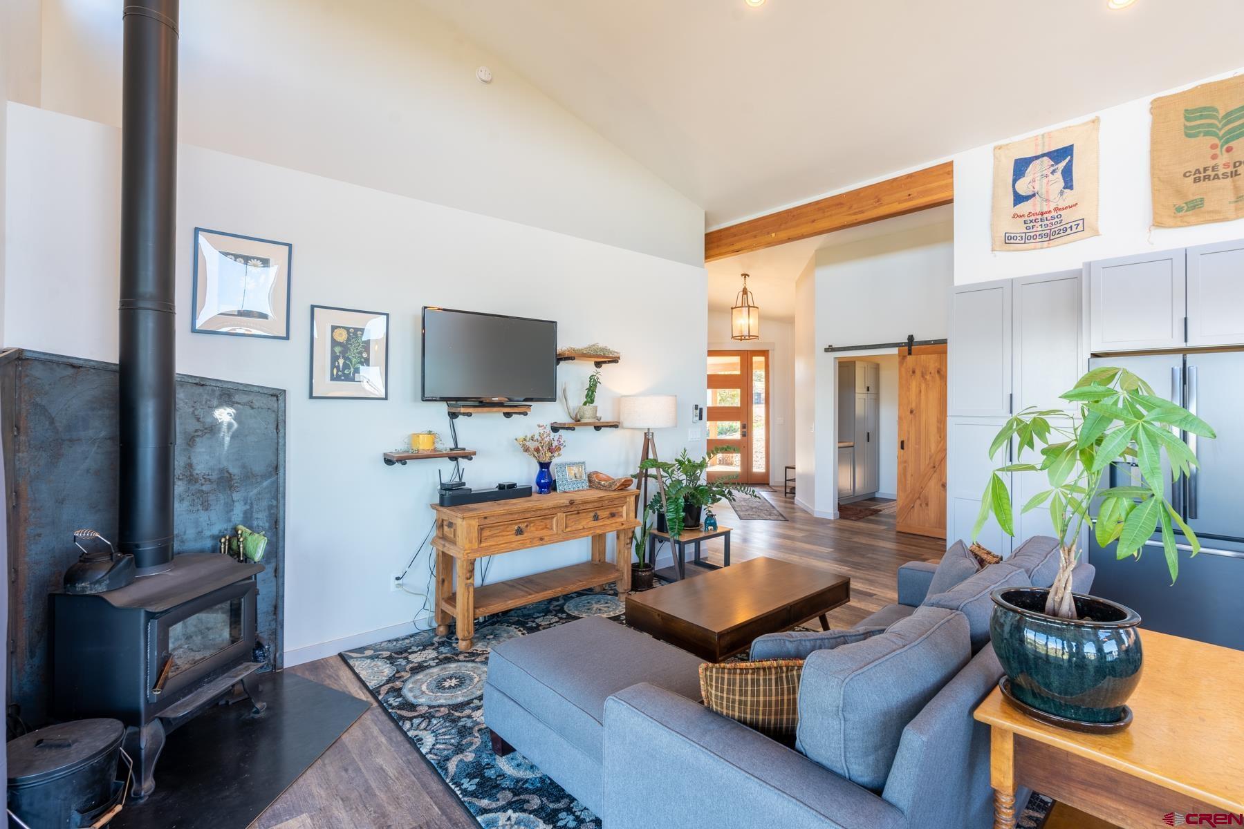 68 Cody Road Durango, CO 81303 - Photo 7 of 35 a living room with furniture and a flat screen tv
