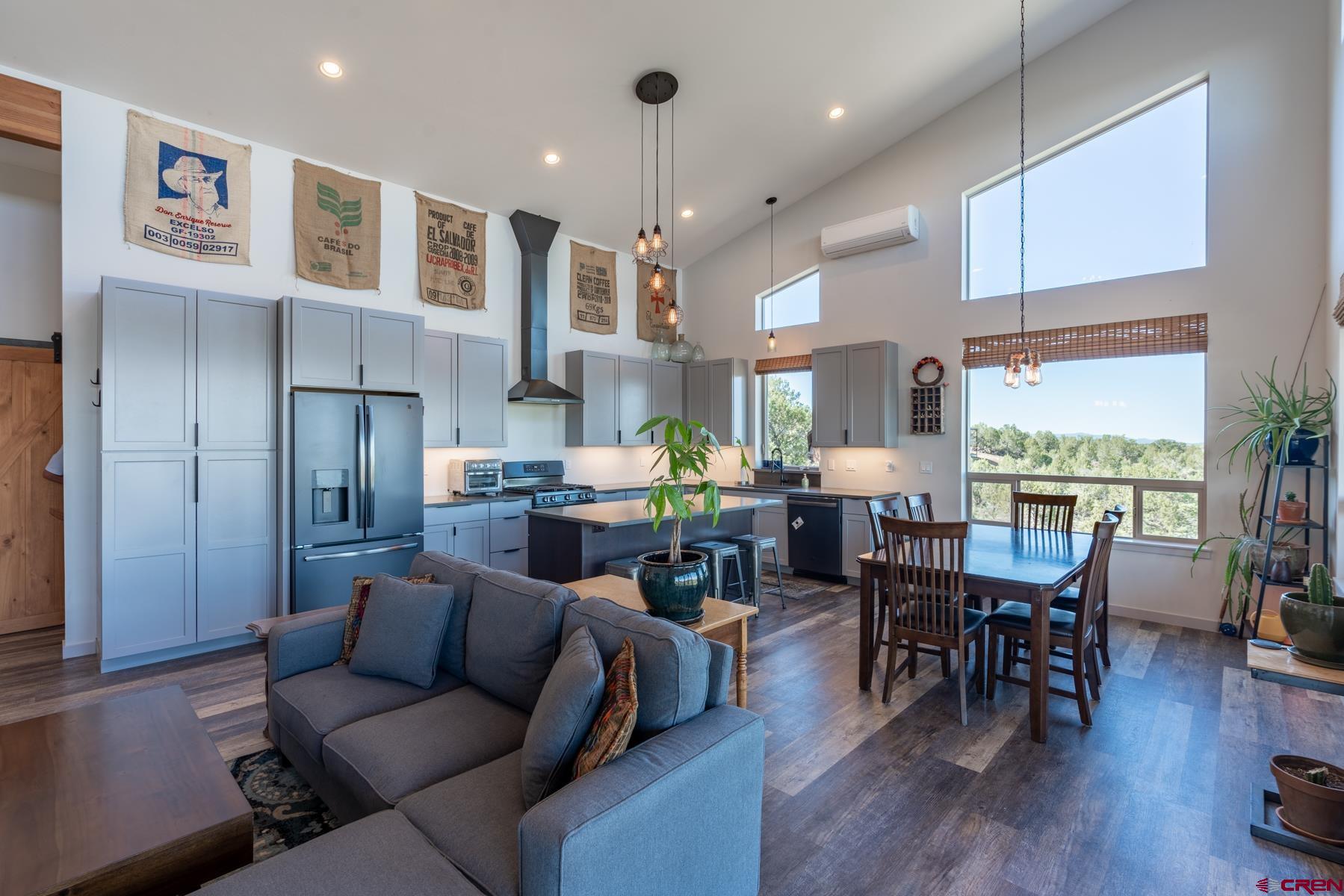 68 Cody Road Durango, CO 81303 - Photo 8 of 35 a living room with stainless steel appliances kitchen island granite countertop furniture and a wooden floor