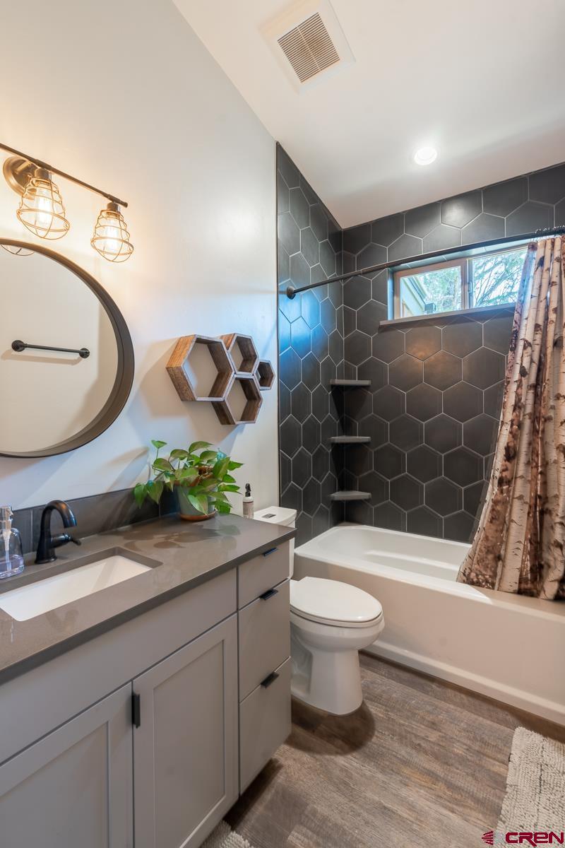 68 Cody Road Durango, CO 81303 - Photo 10 of 35 a bathroom with a sink a toilet and shower