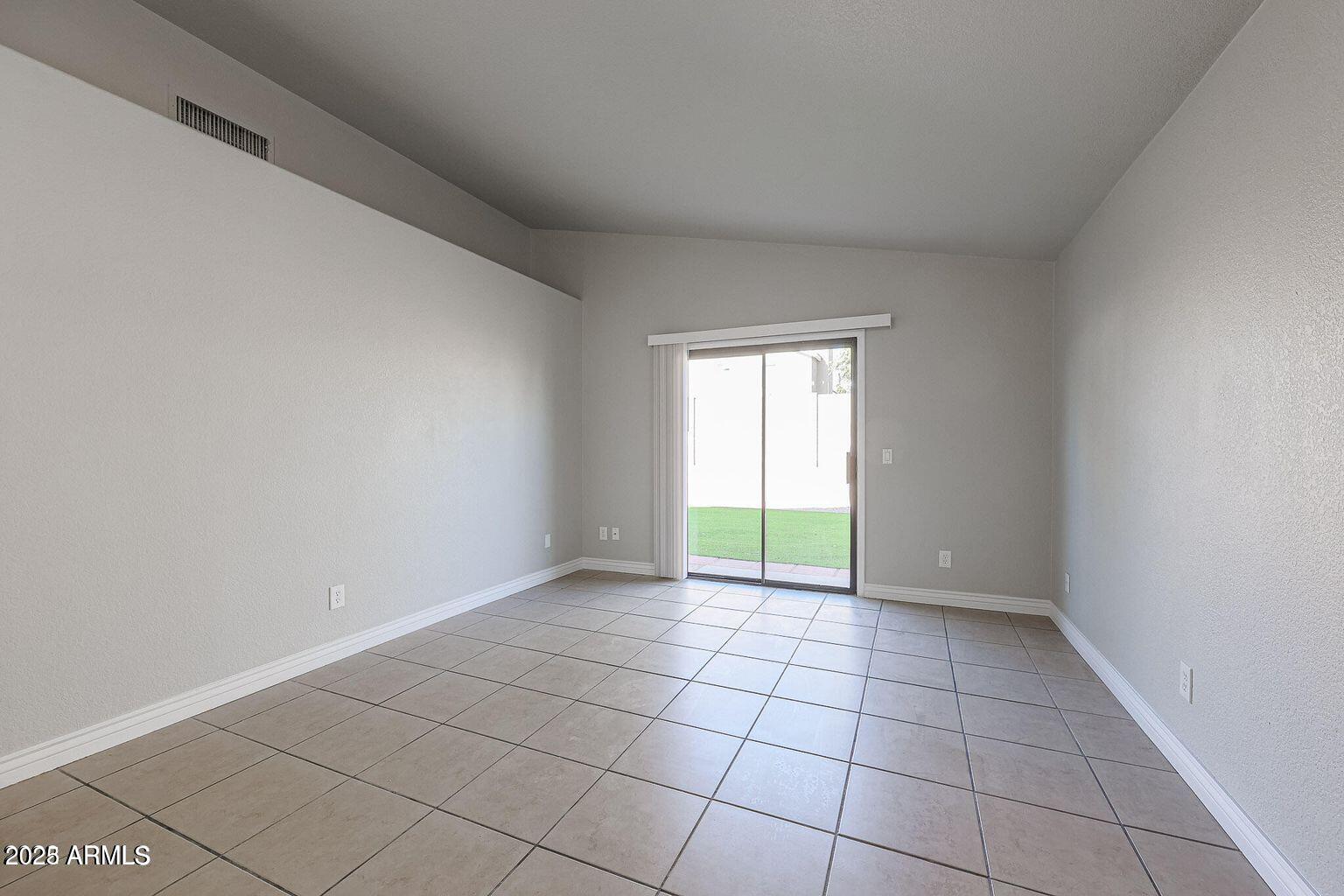 2134 East Robin Lane Phoenix, AZ 85024 - Photo 13 of 24 a view of an empty room with a window