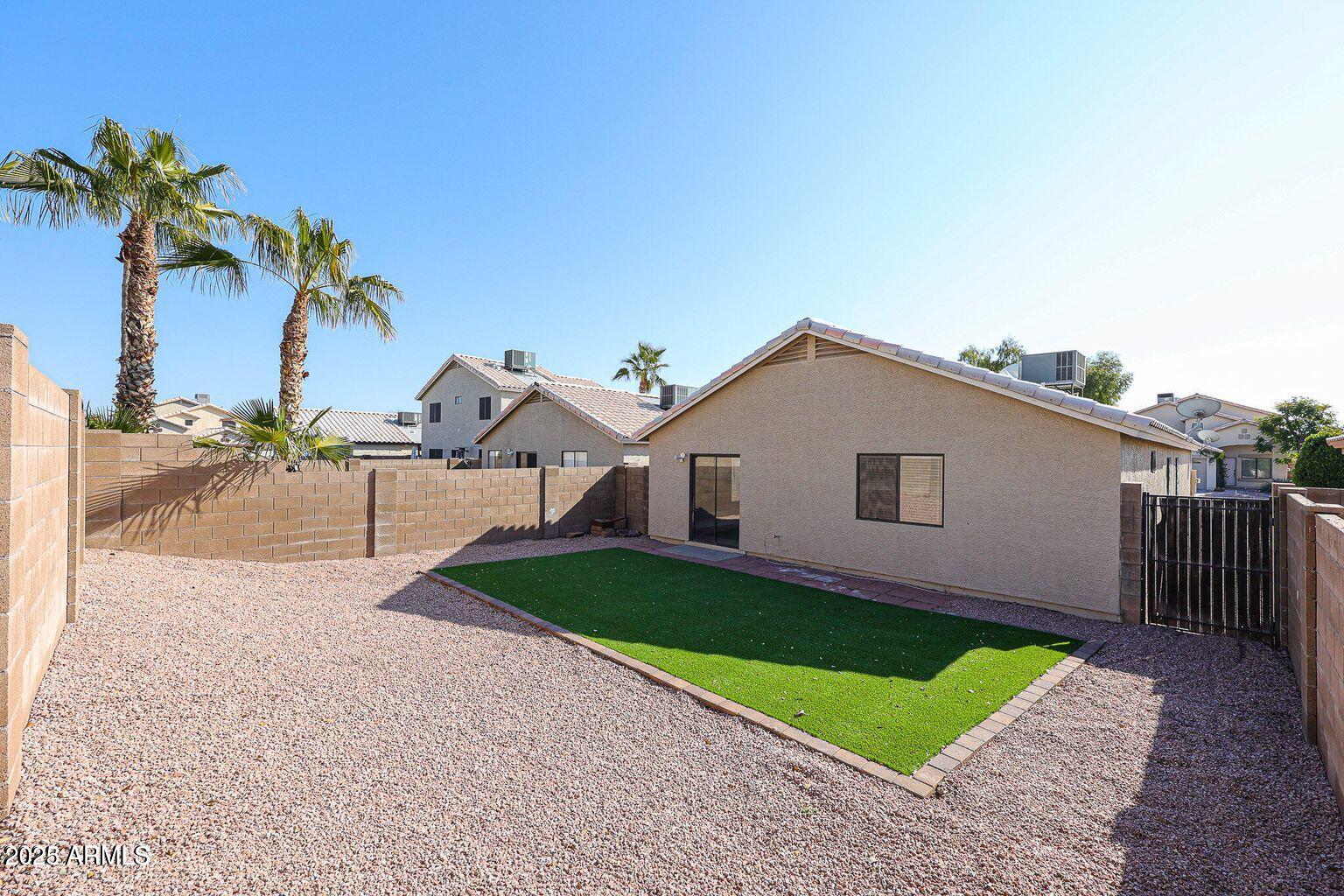 2134 East Robin Lane Phoenix, AZ 85024 - Photo 22 of 24 a view of a house with a yard and a yard