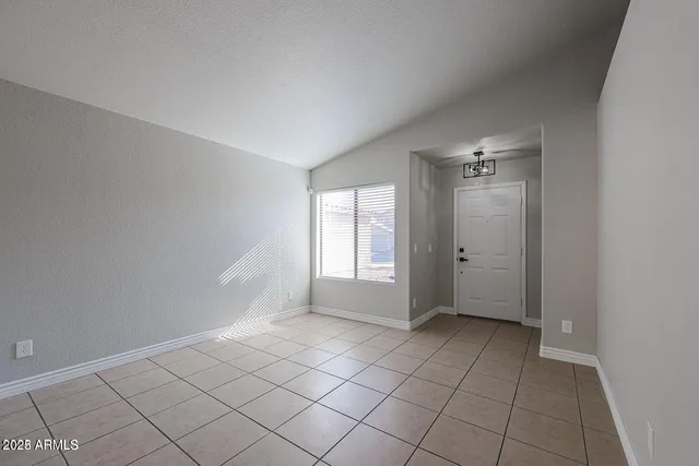a view of an empty room and window