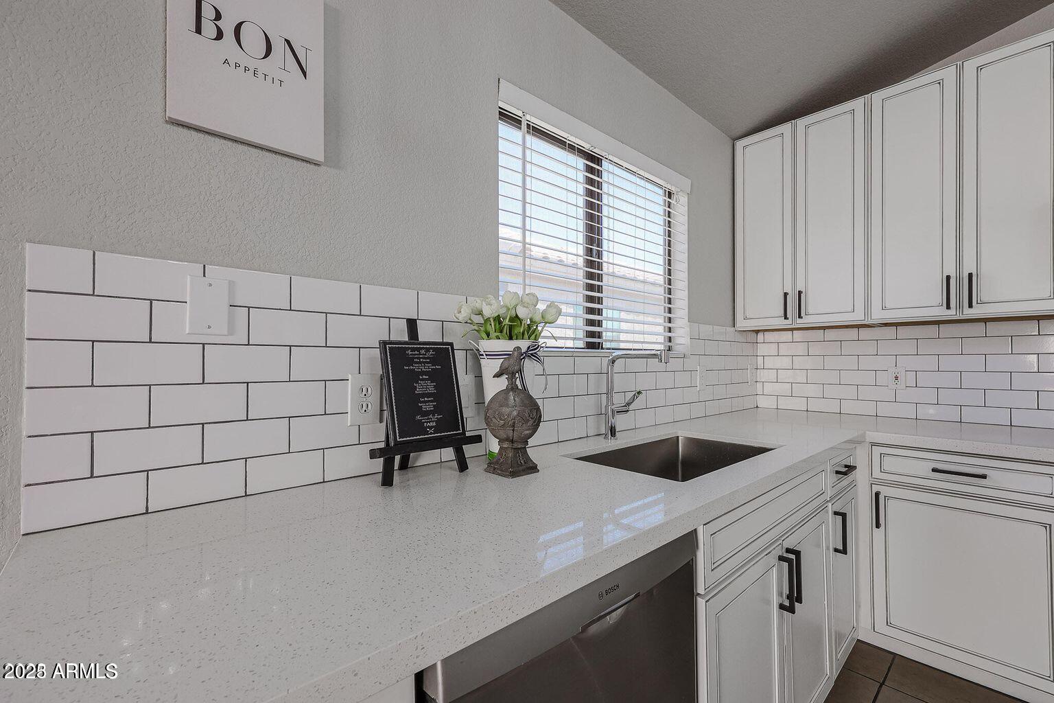 2134 East Robin Lane Phoenix, AZ 85024 - Photo 10 of 24 a view of a kitchen with a sink and cabinets