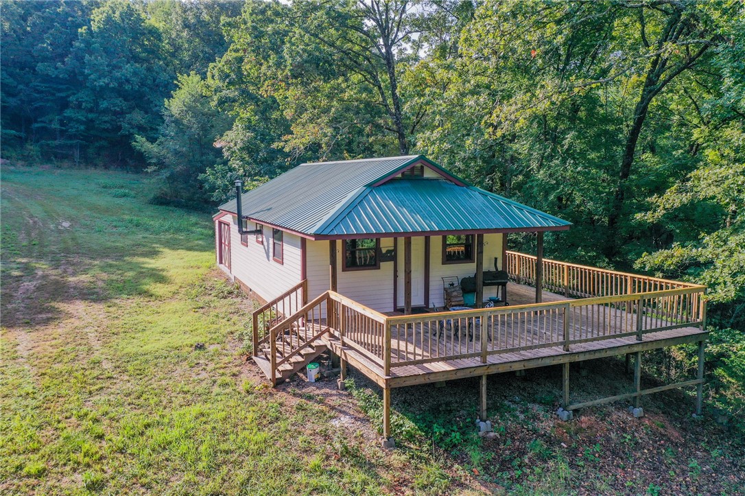 Tbd Bug Scuffle Road Prairie Grove, AR 72753 - Photo 4 of 31 View of front of house featuring a metal roof, a deck, and a front lawn