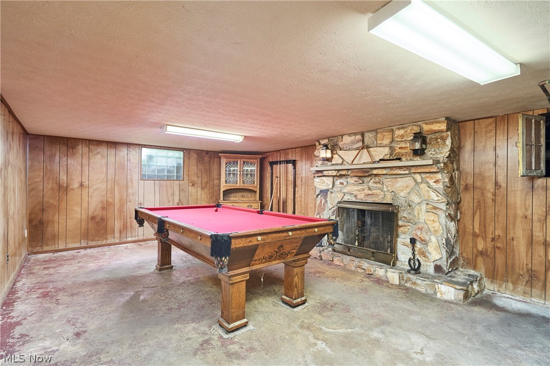535 Crystal Lake Road Akron, OH 44333 - Photo 32 of 40 Lower level Rec Room with stunning stone fireplace.