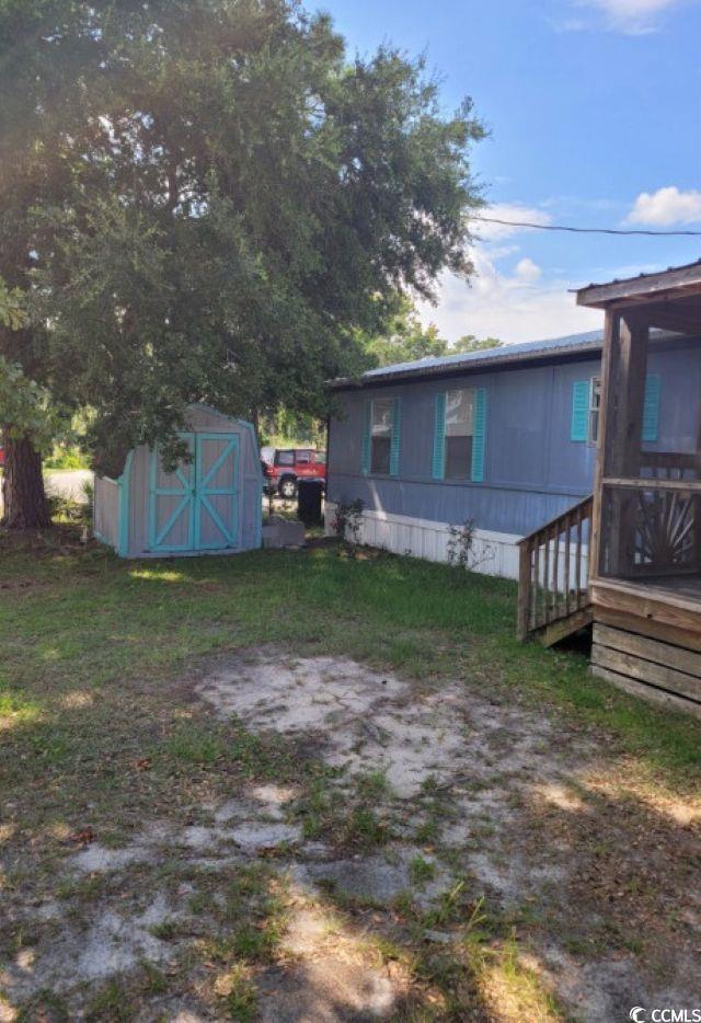 356 Calhoun Drive Murrells Inlet, SC 29576 - Photo 16 of 26 View of yard with a shed