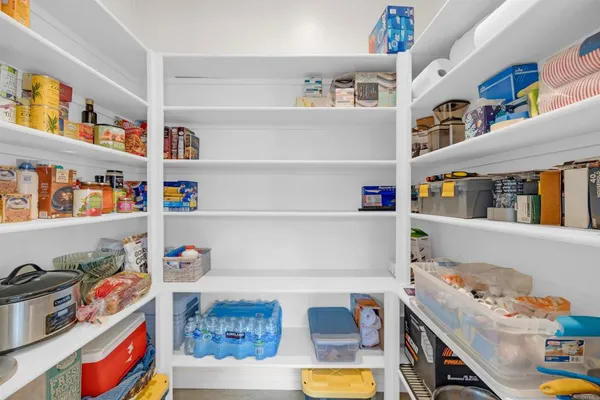 a kitchen with a sink cabinets and appliances