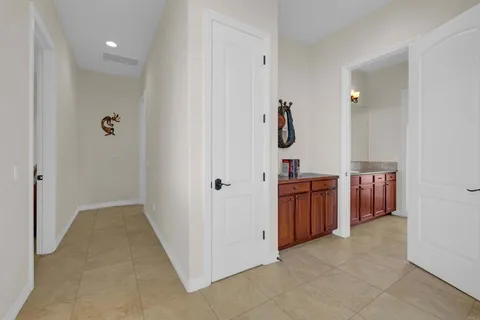 a en suite bathroom with a double vanity sink and a mirror