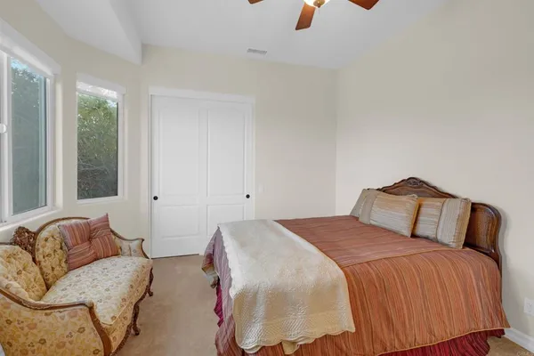 a bedroom with a bed and a fireplace