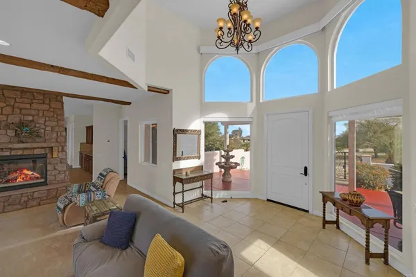 a living room with furniture a fireplace and a table