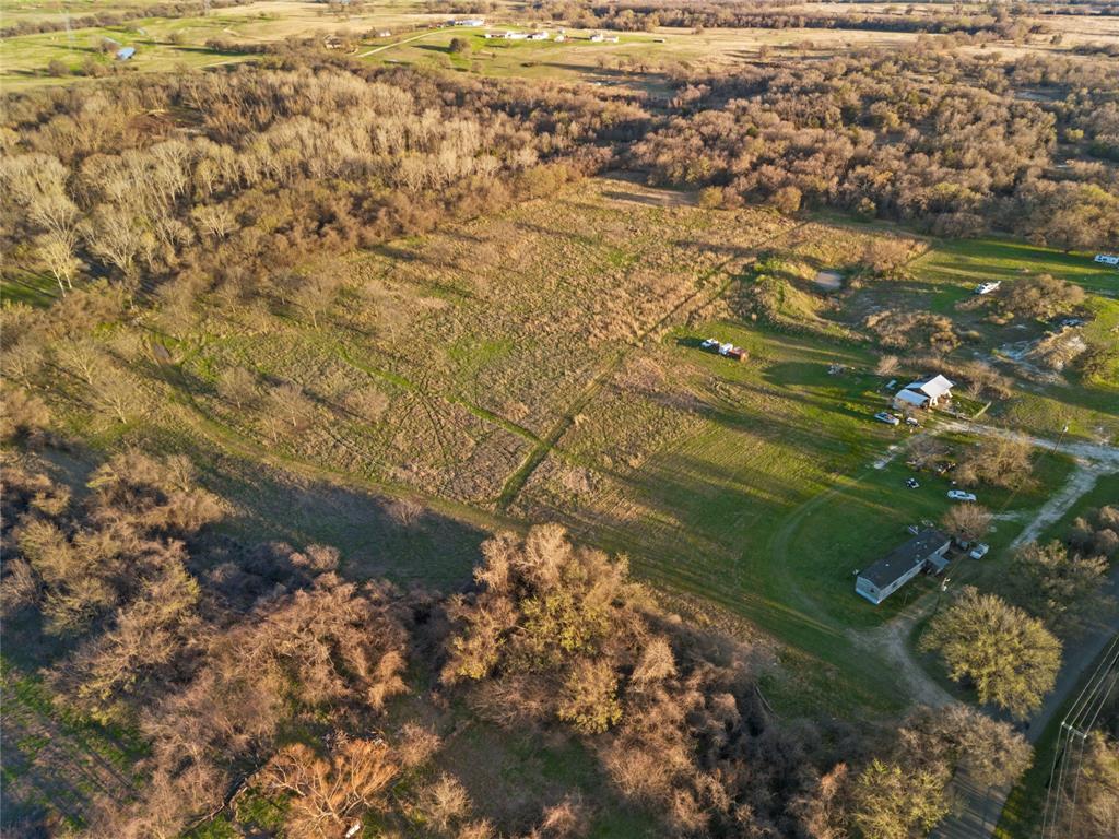 9911 Zion Hill Road Poolville, TX 76487 - Photo 7 of 25 a view of residential houses with yard