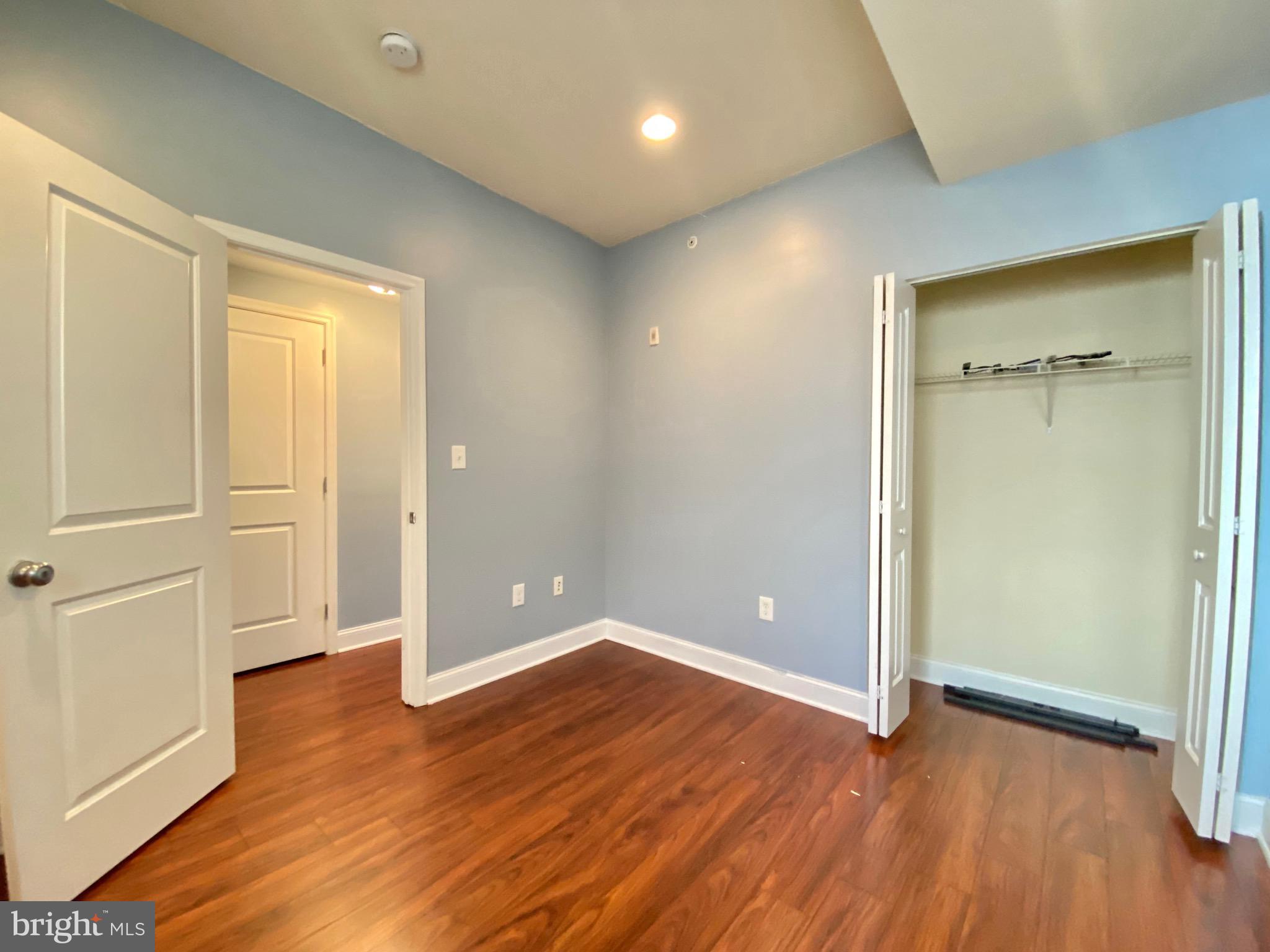 1419 North 17th Street, Unit C Philadelphia, PA 19121 - Photo 11 of 21 wooden floor in an empty room with wooden floor
