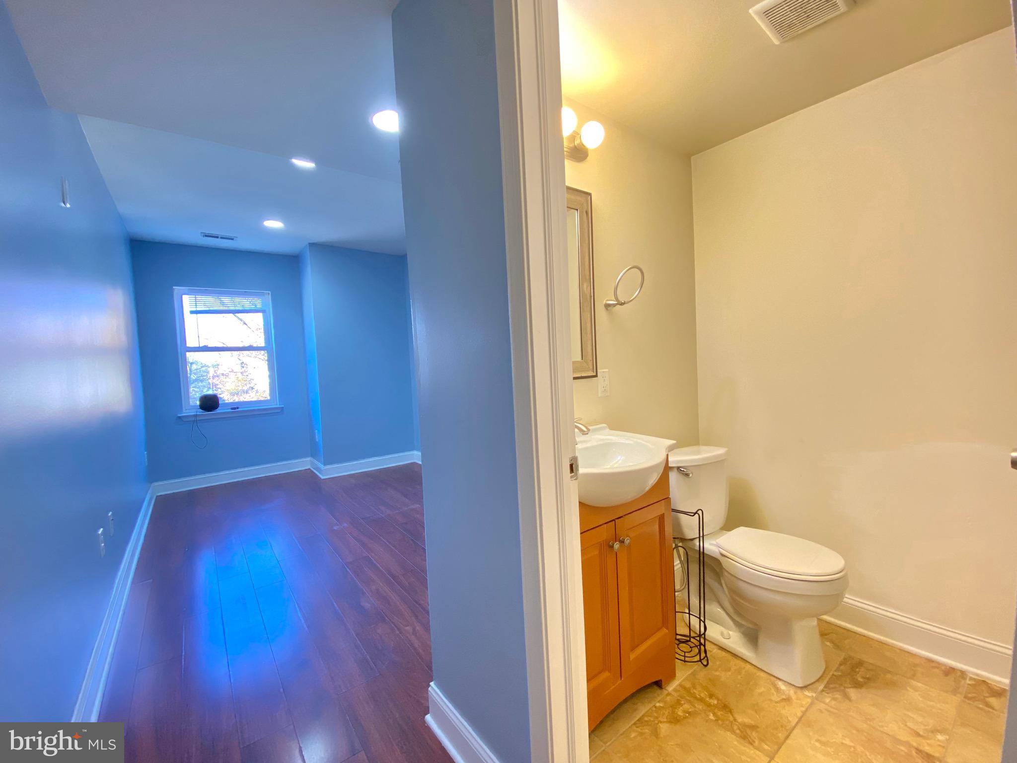1419 North 17th Street, Unit C Philadelphia, PA 19121 - Photo 14 of 21 a bathroom with a toilet and a sink