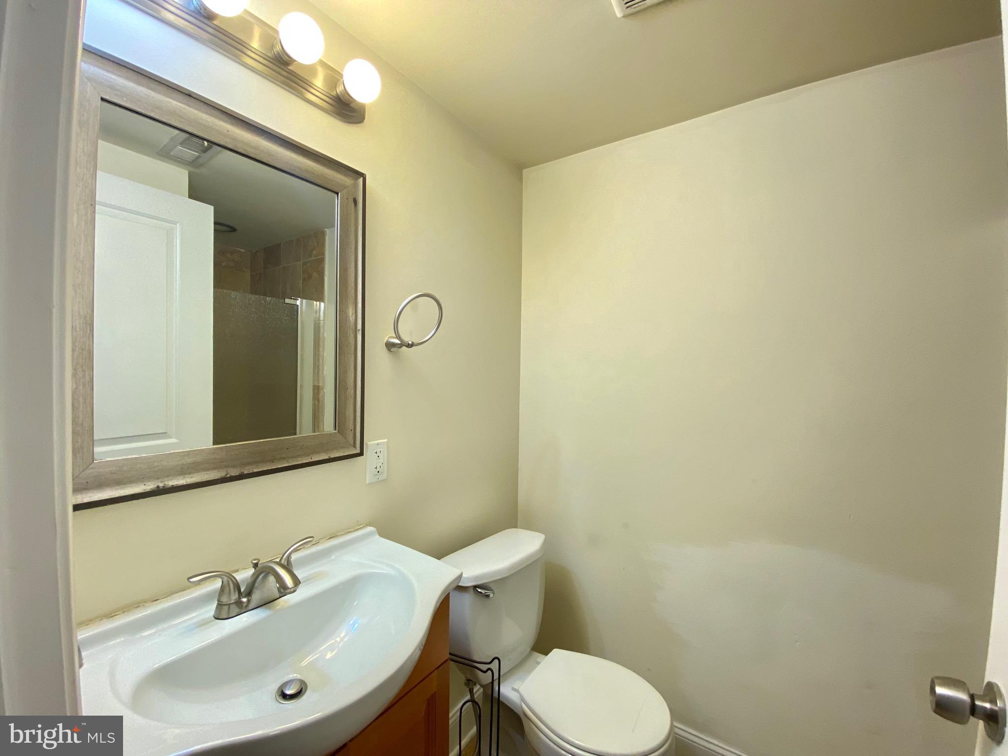 1419 North 17th Street, Unit C Philadelphia, PA 19121 - Photo 16 of 21 a bathroom with a sink and a mirror