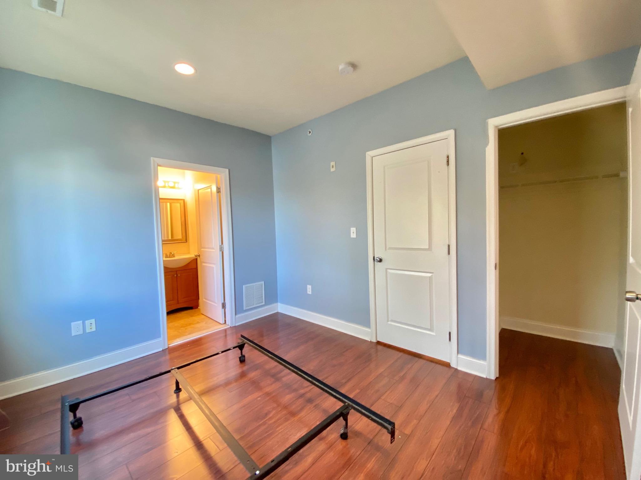 1419 North 17th Street, Unit C Philadelphia, PA 19121 - Photo 7 of 21 a room with wooden floor