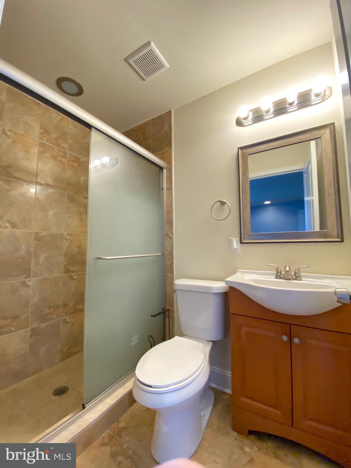 1419 North 17th Street, Unit C Philadelphia, PA 19121 - Photo 9 of 21 a bathroom with a sink toilet and shower