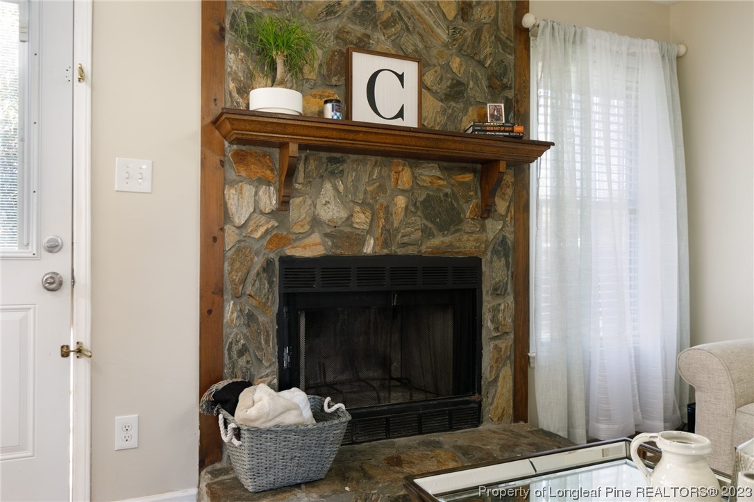 6537 Grist Mill Road Fayetteville, NC 28314 - Photo 13 of 26 a living room with furniture and a fireplace
