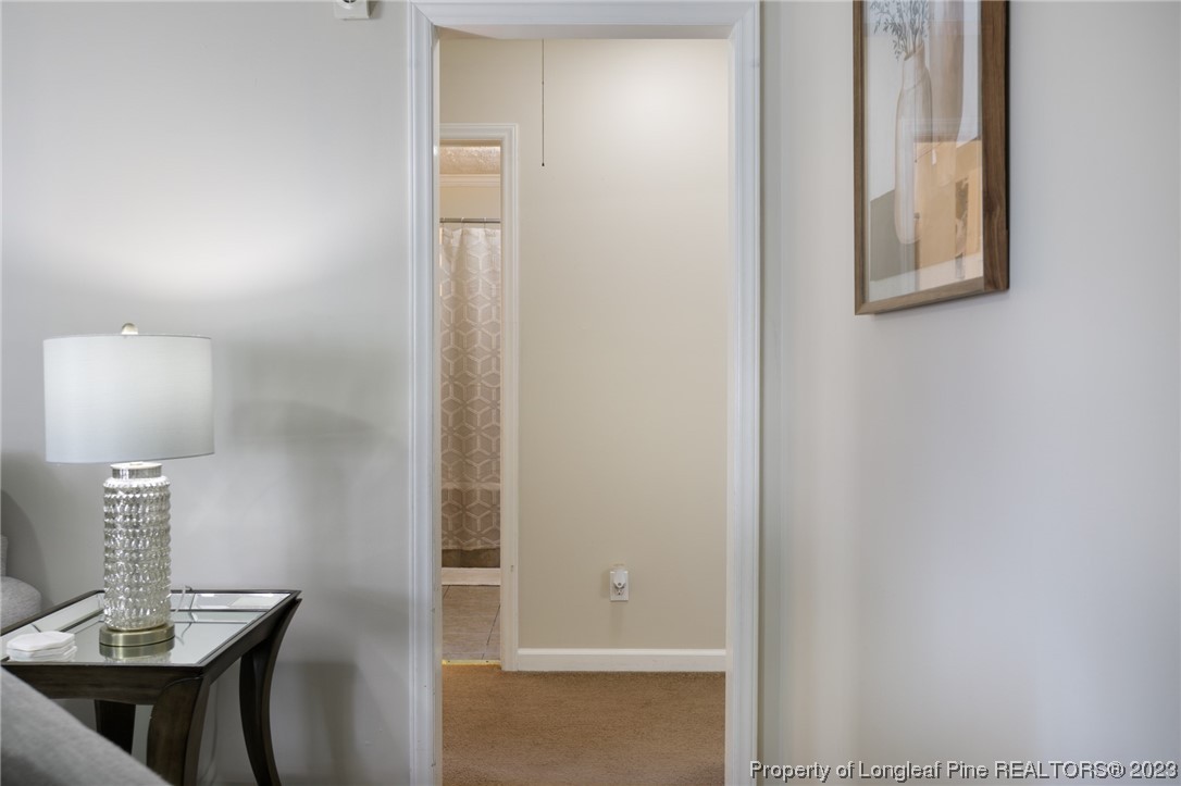 6537 Grist Mill Road Fayetteville, NC 28314 - Photo 14 of 26 a view of a room that has a mirror in it