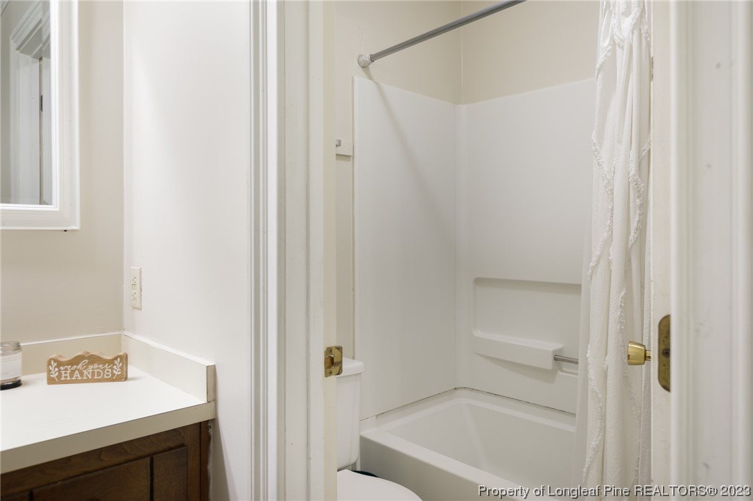 6537 Grist Mill Road Fayetteville, NC 28314 - Photo 22 of 26 a bathroom with a bathtub