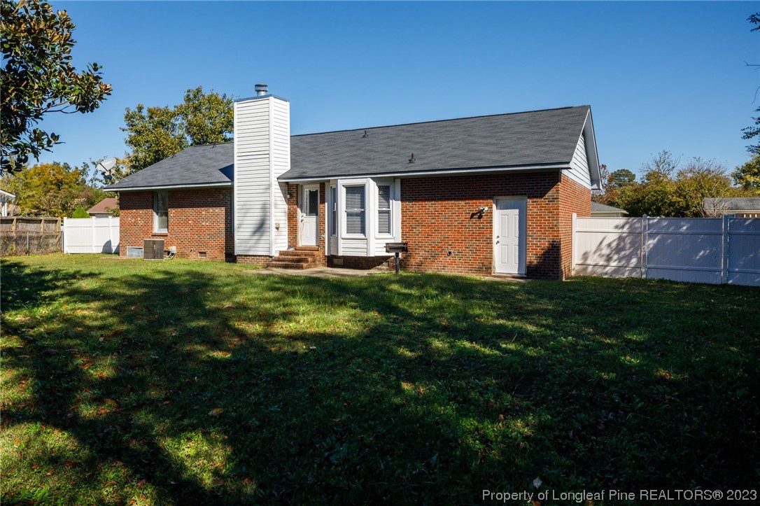 6537 Grist Mill Road Fayetteville, NC 28314 - Photo 25 of 26 a front view of a house with a yard