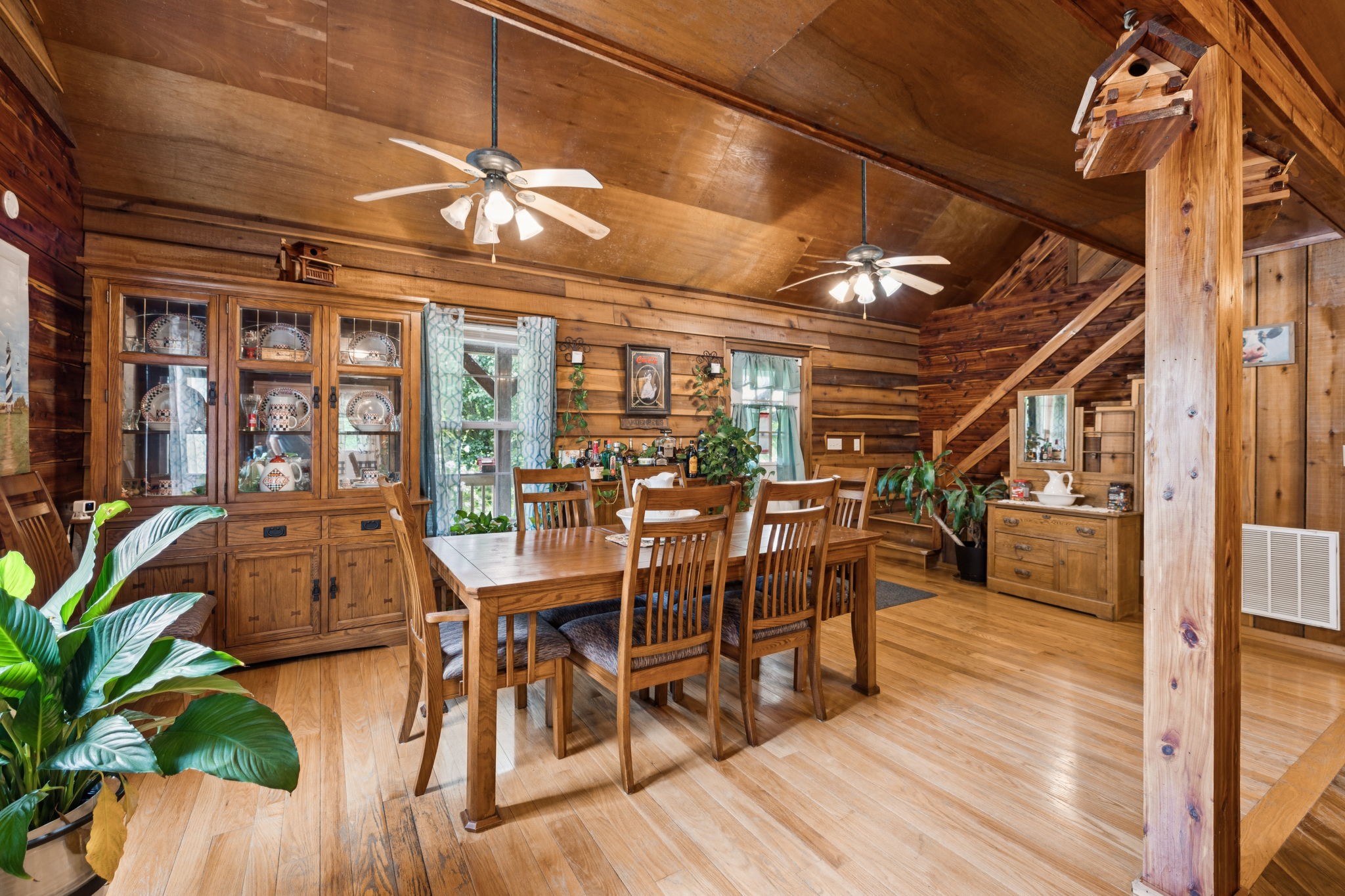 176 Robert Hensley Road Hohenwald, TN 38462 - Photo 15 of 87 a view of a dining room with furniture window and wooden floor