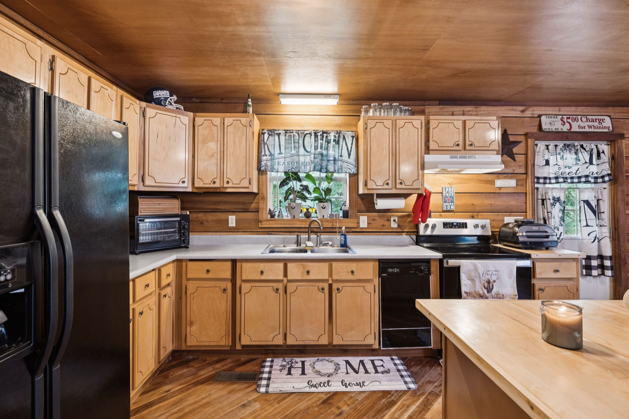 176 Robert Hensley Road Hohenwald, TN 38462 - Photo 22 of 87 a kitchen with stainless steel appliances granite countertop a sink stove and refrigerator