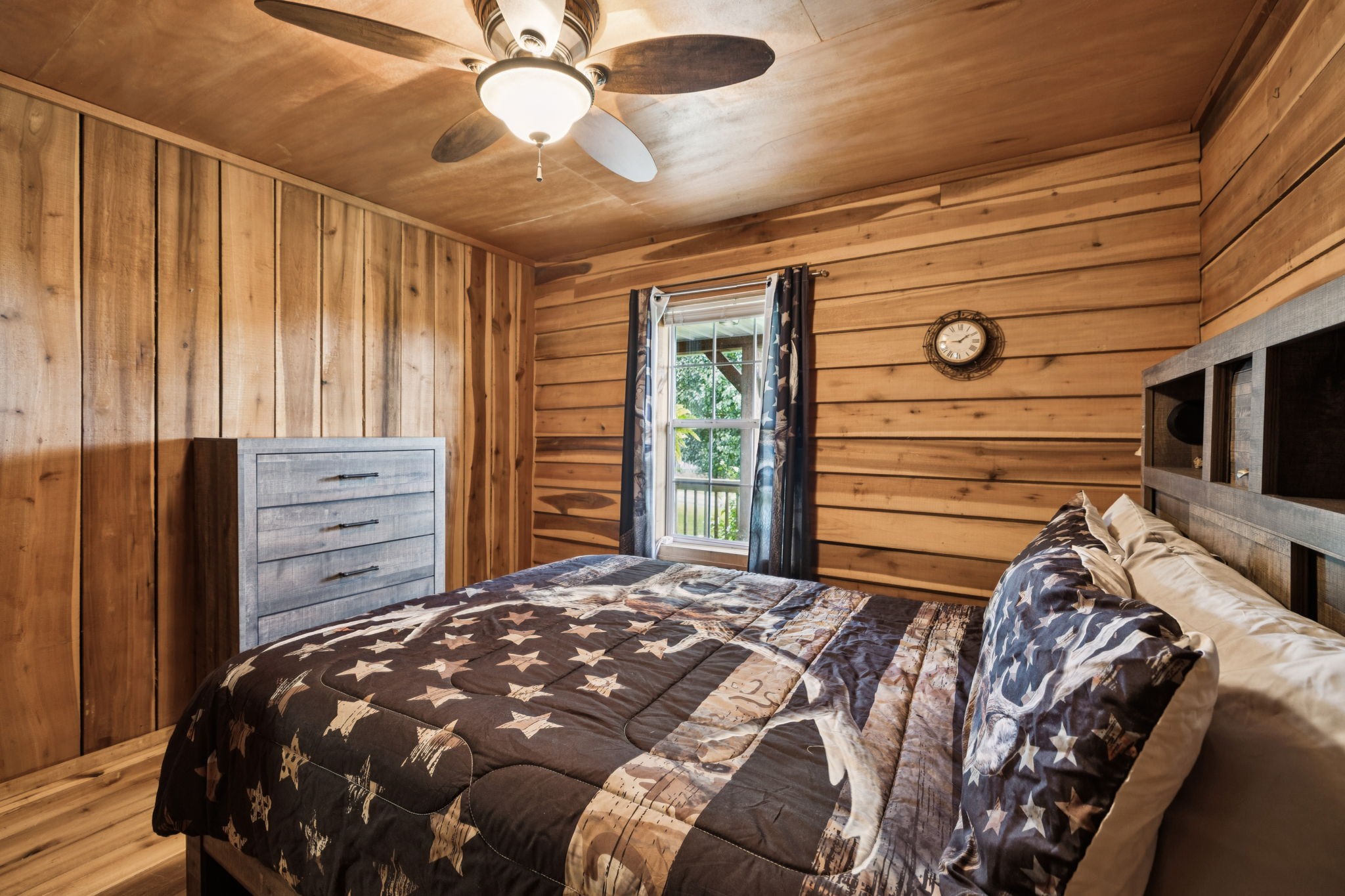 176 Robert Hensley Road Hohenwald, TN 38462 - Photo 25 of 87 a bedroom with a bed and a dresser