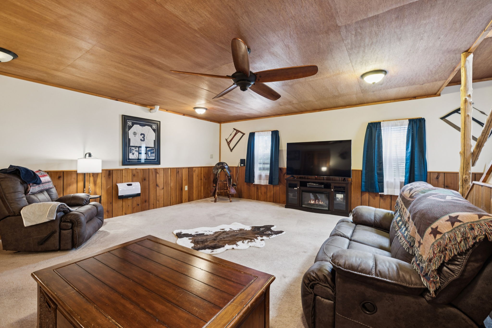 176 Robert Hensley Road Hohenwald, TN 38462 - Photo 32 of 87 a living room with furniture and a flat screen tv