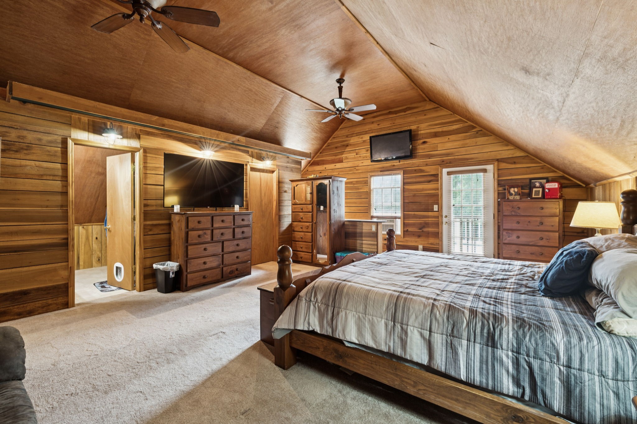 176 Robert Hensley Road Hohenwald, TN 38462 - Photo 36 of 87 a bedroom with a bed window and a walk in closet